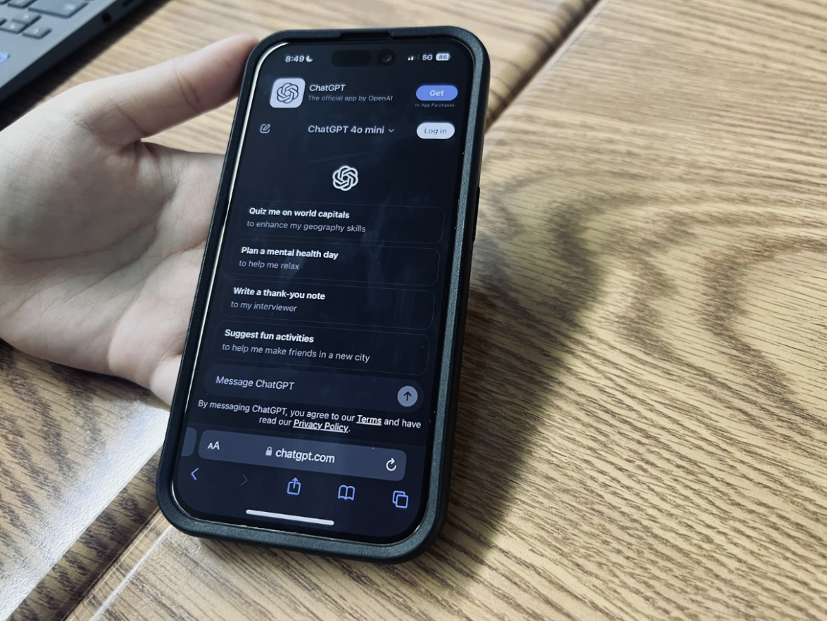 A student uses the ChatGPT app on their smartphone. AI apps like ChatGPT give the user suggested prompts and can do everything from help with math problems to write research essays with citations. 